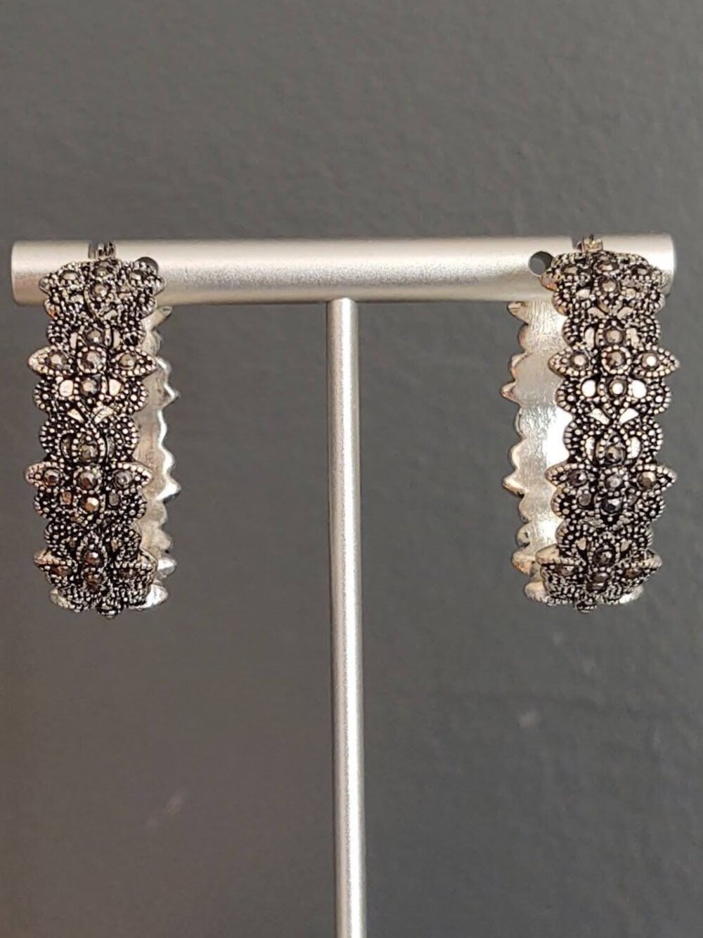 Textured silver hoop earrings with black detail